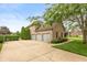 Garage featuring three bays and a driveway at 725 Ridge Gate Dr, Brownsburg, IN 46112