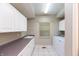 Convenient laundry room with ample counter space and storage cabinets at 725 Ridge Gate Dr, Brownsburg, IN 46112