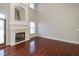 Living room with a fireplace and gleaming hardwood floors at 725 Ridge Gate Dr, Brownsburg, IN 46112