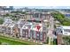 Aerial view of townhomes featuring modern architecture and landscaping in an urban setting, marked with red pin at 751 Switchyard Pl, Indianapolis, IN 46202
