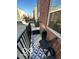 Cozy balcony featuring black metal railings, stylish rug, and comfortable outdoor seating at 751 Switchyard Pl, Indianapolis, IN 46202