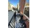 Cozy balcony featuring black metal railings, stylish rug, and comfortable outdoor seating at 751 Switchyard Pl, Indianapolis, IN 46202