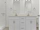 Modern bathroom features double sinks, white cabinets, and a glass enclosed shower at 751 Switchyard Pl, Indianapolis, IN 46202