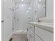 Modern bathroom features a glass-enclosed shower, white cabinets and gray tile floors at 751 Switchyard Pl, Indianapolis, IN 46202
