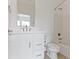 Clean, all-white bathroom with modern fixtures and a shower-tub combination at 751 Switchyard Pl, Indianapolis, IN 46202
