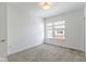 Bright bedroom with neutral carpet and large window overlooking the neighborhood at 751 Switchyard Pl, Indianapolis, IN 46202