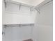 Walk-in closet features shelving, lighting, and a neutral carpet at 751 Switchyard Pl, Indianapolis, IN 46202