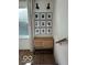 Hallway with a storage cabinet and picture frames on the wall at 751 Switchyard Pl, Indianapolis, IN 46202