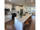 Modern kitchen featuring stainless steel appliances, white cabinets, and a large island at 751 Switchyard Pl, Indianapolis, IN 46202