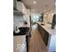 Modern kitchen featuring stainless steel appliances, white cabinets, and a large island at 751 Switchyard Pl, Indianapolis, IN 46202