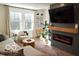 Bright living room with a fireplace, large windows, and comfortable seating at 751 Switchyard Pl, Indianapolis, IN 46202