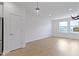 Bright, open living room with hardwood floors, recessed lighting, and large windows for ample natural light at 751 Switchyard Pl, Indianapolis, IN 46202