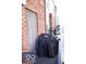 View of a patio with a grill, furniture, and a brick wall at 751 Switchyard Pl, Indianapolis, IN 46202