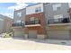Modern townhomes showcasing individual balconies and garage doors in a contemporary design at 751 Switchyard Pl, Indianapolis, IN 46202
