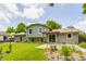 This home features a well-maintained yard and backyard pergola, perfect for outdoor living at 8015 Ridgegate East Dr, Indianapolis, IN 46268