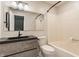 Updated bathroom features modern vanity, large mirror and shower/tub combo at 8015 Ridgegate East Dr, Indianapolis, IN 46268