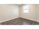 This bedroom features tile floor, neutral walls, and a bright window at 8015 Ridgegate East Dr, Indianapolis, IN 46268