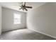 This is a cozy bedroom with neutral walls and plush carpeting at 8015 Ridgegate East Dr, Indianapolis, IN 46268