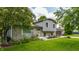Charming two-story home featuring a stone facade, well-maintained landscaping and inviting curb appeal at 8015 Ridgegate East Dr, Indianapolis, IN 46268