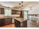 Modern kitchen with stainless steel appliances, updated cabinets, and a center island with granite countertop at 8015 Ridgegate East Dr, Indianapolis, IN 46268