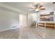 This additional living area boasts tile floor, a ceiling fan, stairs to the kitchen, and two large closets at 8015 Ridgegate East Dr, Indianapolis, IN 46268