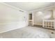 Spacious living room with neutral carpet and paint, and a view to the entry and stairs at 8015 Ridgegate East Dr, Indianapolis, IN 46268