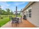 Relaxing back deck with outdoor furniture, grill, and pergola on a sunny day at 8315 Exton Rd, Indianapolis, IN 46239