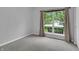 Bedroom with large window providing natural light and a view of the outdoors at 8315 Exton Rd, Indianapolis, IN 46239