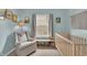 Charming Bedroom features a cozy chair, baby crib, and playful decorations at 8315 Exton Rd, Indianapolis, IN 46239