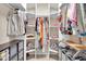 Walk-in closet with organized shelving, hanging rods, and ample storage space at 8315 Exton Rd, Indianapolis, IN 46239
