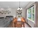 Charming dining room with natural light, wooden table, and a cozy atmosphere for Gathering meals at 8315 Exton Rd, Indianapolis, IN 46239