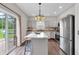 Modern kitchen with stainless steel appliances, island with seating, and lots of cabinet space at 8315 Exton Rd, Indianapolis, IN 46239