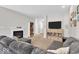 Inviting living room with a fireplace, providing a cozy ambiance for relaxation and Gathering gatherings at 8315 Exton Rd, Indianapolis, IN 46239