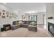Spacious living room featuring plush carpeting, a cozy fireplace, and an open layout for comfortable living at 8315 Exton Rd, Indianapolis, IN 46239