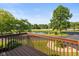 Enjoy relaxing backyard views of the pond and surrounding trees from the privacy of your wooden deck at 8955 Stonegate Rd # A, Indianapolis, IN 46227