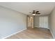 Large bedroom features modern flooring, ceiling fan, and closet at 8955 Stonegate Rd # A, Indianapolis, IN 46227