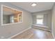 Bright dining room features updated lighting, neutral paint, and a pass-through to the adjacent room at 8955 Stonegate Rd # A, Indianapolis, IN 46227