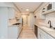 Galley kitchen with white cabinets, granite countertops, and stainless-steel appliances at 8955 Stonegate Rd # A, Indianapolis, IN 46227