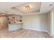 Eat-in kitchen features granite countertops and new vinyl flooring at 8955 Stonegate Rd # A, Indianapolis, IN 46227