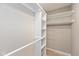 Walk-in closet with shelving and metal grid storage at 8955 Stonegate Rd # A, Indianapolis, IN 46227