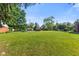 Expansive backyard featuring a well-maintained lawn at 1010 Maple St, Greenwood, IN 46142