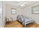 Cozy bedroom with hardwood floors, natural light, and a ceiling fan at 1010 Maple St, Greenwood, IN 46142