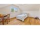 Cozy bedroom featuring a large window and hardwood floors at 1010 Maple St, Greenwood, IN 46142