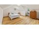 Bright attic bedroom with hardwood floors, natural light, and modern decor at 1010 Maple St, Greenwood, IN 46142