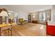 Bright living room with hardwood floors, a large window, and classic furnishings at 1010 Maple St, Greenwood, IN 46142