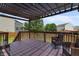 Relax on this lovely back deck with pergola, complete with seating and a view of the backyard at 10312 Gladeview Dr, Indianapolis, IN 46239