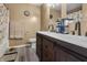 Well-lit bathroom boasts a double sink vanity, a toilet, and a shower/tub combo at 10312 Gladeview Dr, Indianapolis, IN 46239
