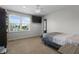 Bedroom with carpet, ceiling fan, TV, and a view of the neighborhood at 10312 Gladeview Dr, Indianapolis, IN 46239