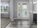 Bright foyer featuring hard surface floors, an elegant door, and neutral paint at 10312 Gladeview Dr, Indianapolis, IN 46239