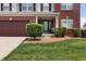 A classic home featuring an inviting front porch and lovely landscaping at 10312 Gladeview Dr, Indianapolis, IN 46239